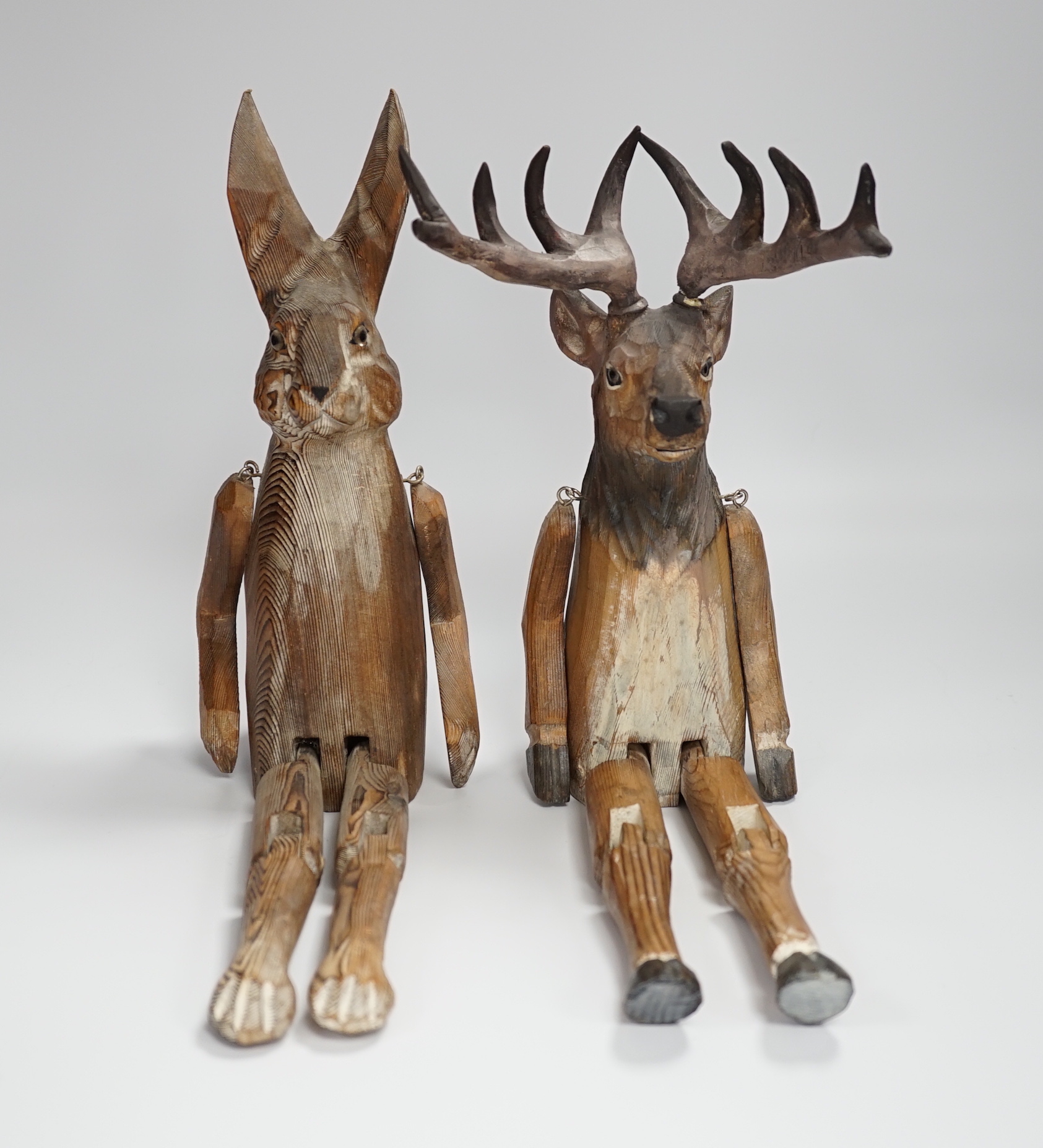 A of novelty jointed carved wooden Deer and similar Hare - 43cm